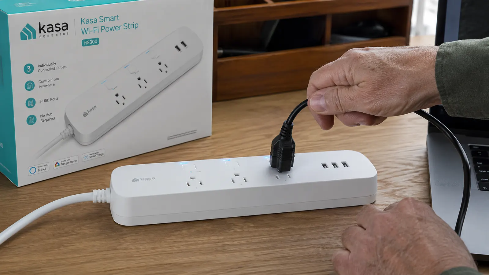 Close-up of Kasa HS300 power strip showing six individually controlled outlet buttons and USB ports